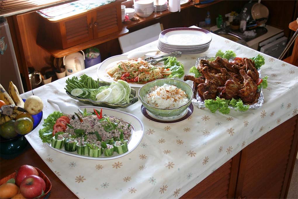 yle lunch of BBQ chickehostess trolley on board nyami charter cat loded with beautifully presented buffet stn wings and thai style salads along with bowls of fresh fruit